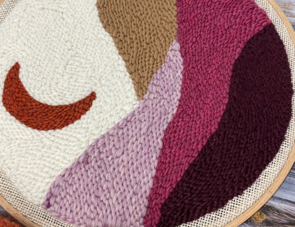 up close shot of stitch detail in moon landscape punch needle design