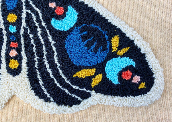 up close shot of the right bottom wing of the celestial moth design