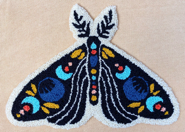 finished celestial moth punch needle design