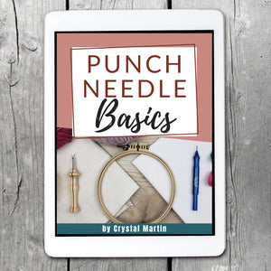 Punch Needle Basics ebook cover on a white iPad laying on a wood table