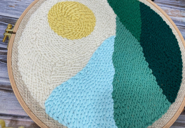 up close shot of stitch detail in sun landscape wall hanging