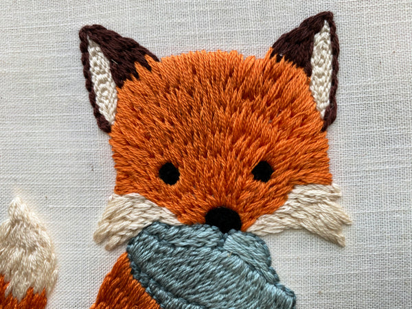 up close shot of foxes head in Fox in a Scarf punch needle pattern