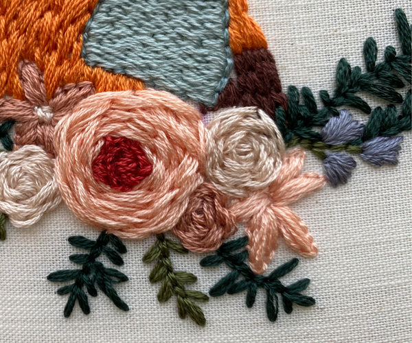 up close shot of stitch details on the flowers in Fox in a Scarf design