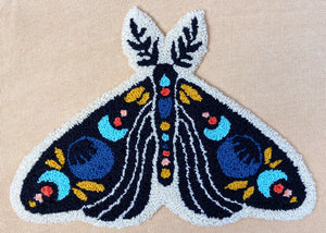 picture of finished celestial moth punch needle design